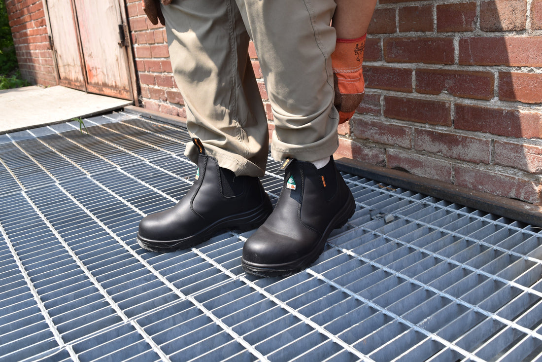 CSA-approved composite toe work boots on worker standing on metal grate outdoors
